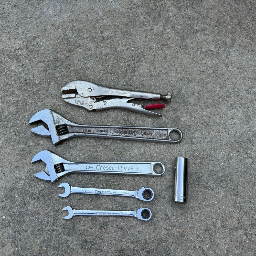 Crescent Tool adjustable wrench, locking plier, two ratcheting wrenches, socket